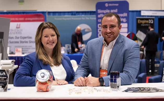 2 happy NLA staff members at a table